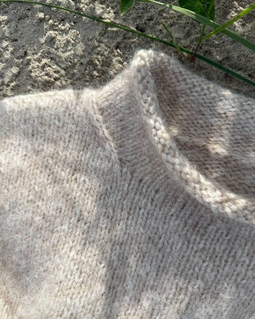 Closeup af beige Cloud Sweater