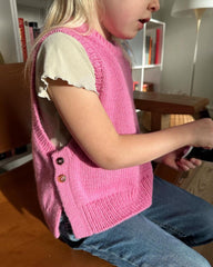 Barn iført pink Lulu Slipover Junior