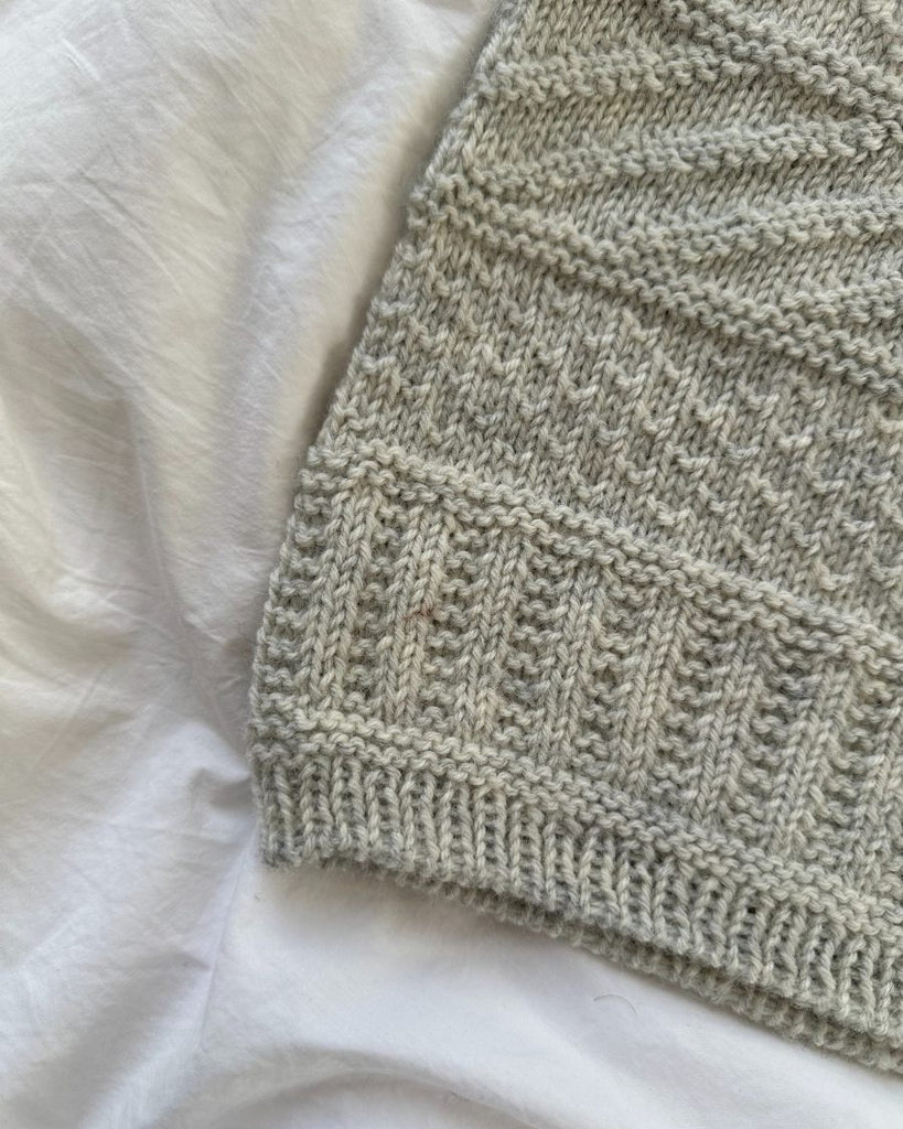 Detaljebillede af lysegrå Storm Slipover Junior