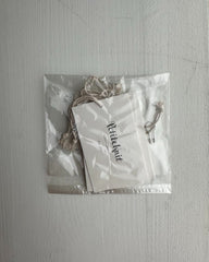 5 strikkemærker med snor og sikkerhedsnål i naturflex pose