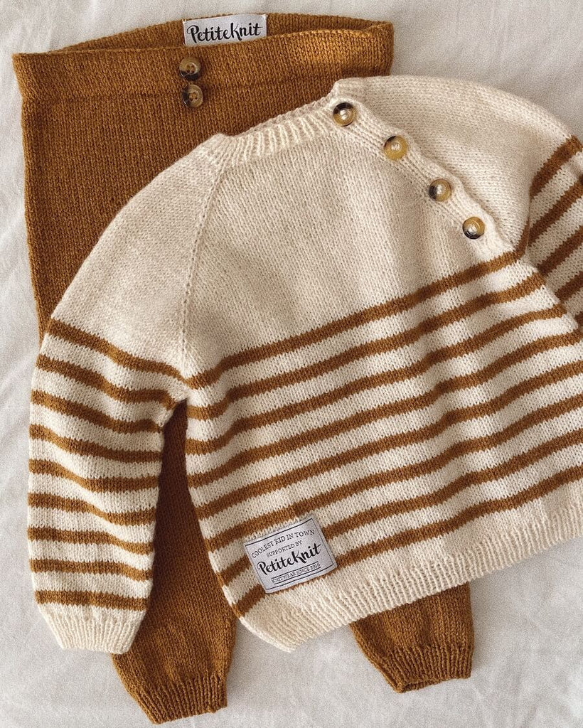 Liggebillede af brunt og hvidt Seaside Set