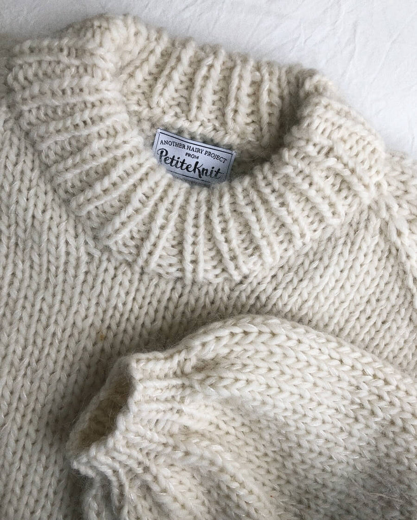 Closeup af hvid Holiday Sweater