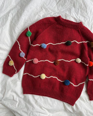 Liggebillede med rød Let's Christmas Sweater