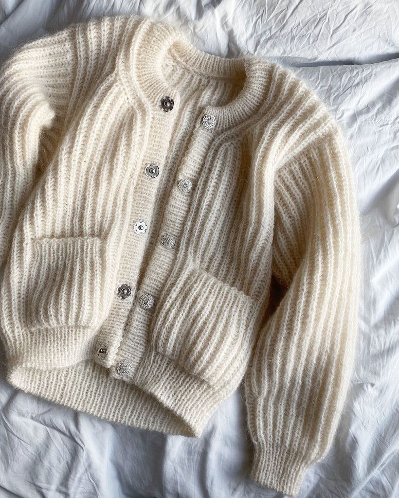 Liggebillede af hvid September Jakke