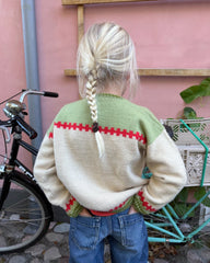 Barn iført Cross Cardigan Junior set bagfra