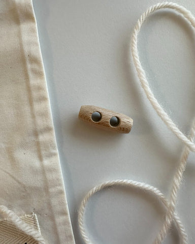 1 stk små duffelknap i træ