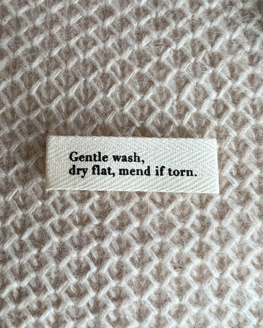 "Gentle wash, dry flat, mend if torn." label - Wholesale