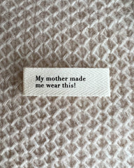 "My mother made me wear this!"-label